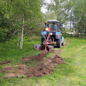 Tractor with fire plow at the forest-willage border