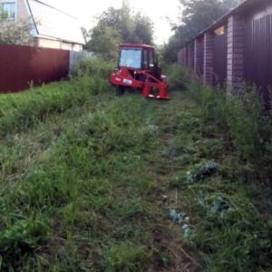 Tractor with roadside mower