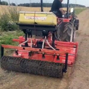 Tractor with seeder and roller for creating lawns