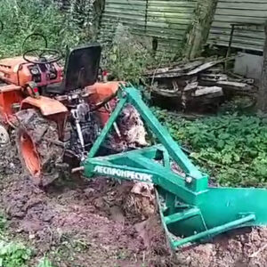 Plow for cuttting roots and Kubota 7001 tractor