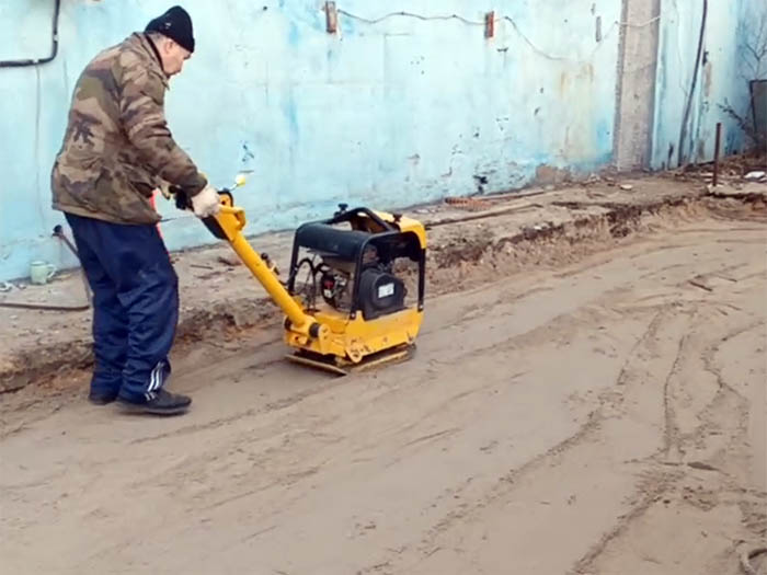 compacting layers of backfill soil