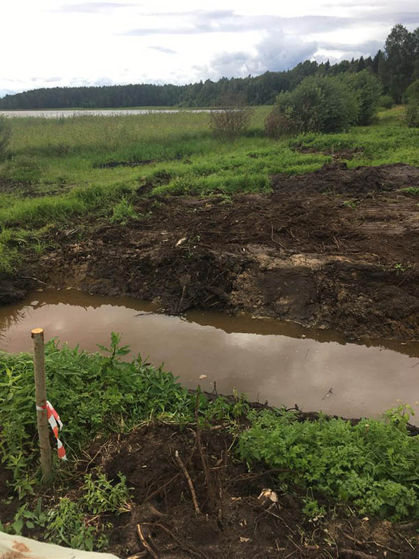 the drainage ditch is full of water